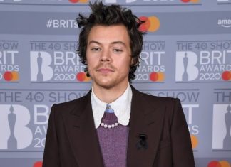 Harry Styles Covers “Grease” Classic “Hopelessly Devoted To You” at a Halloween Show